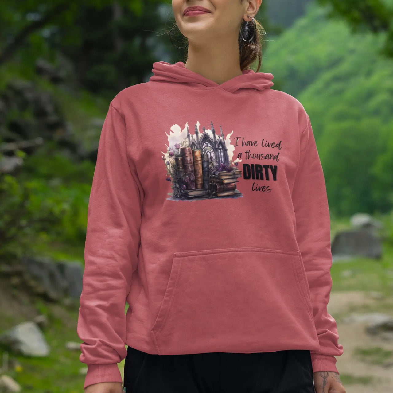 woman wearing a dark pink I have lived a thousand dirty lives hoodie V2 Design B