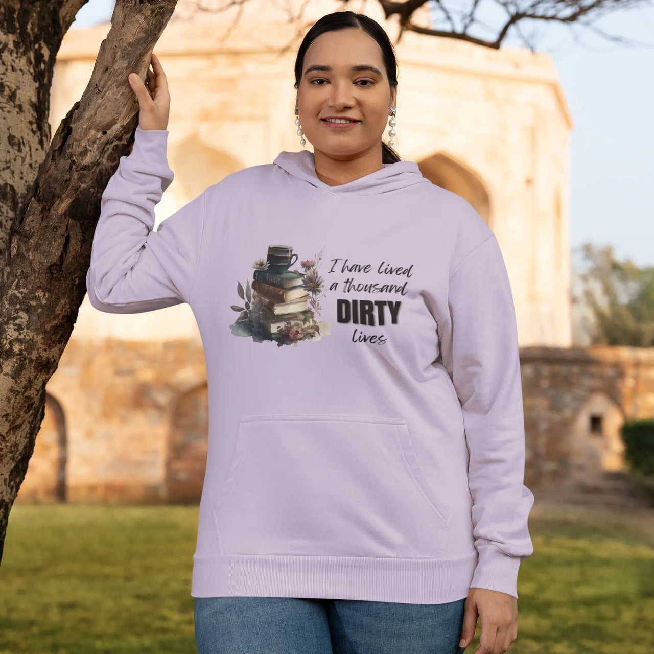 woman wearing an orchid colored I have lived a thousand dirty lives hoodie V2