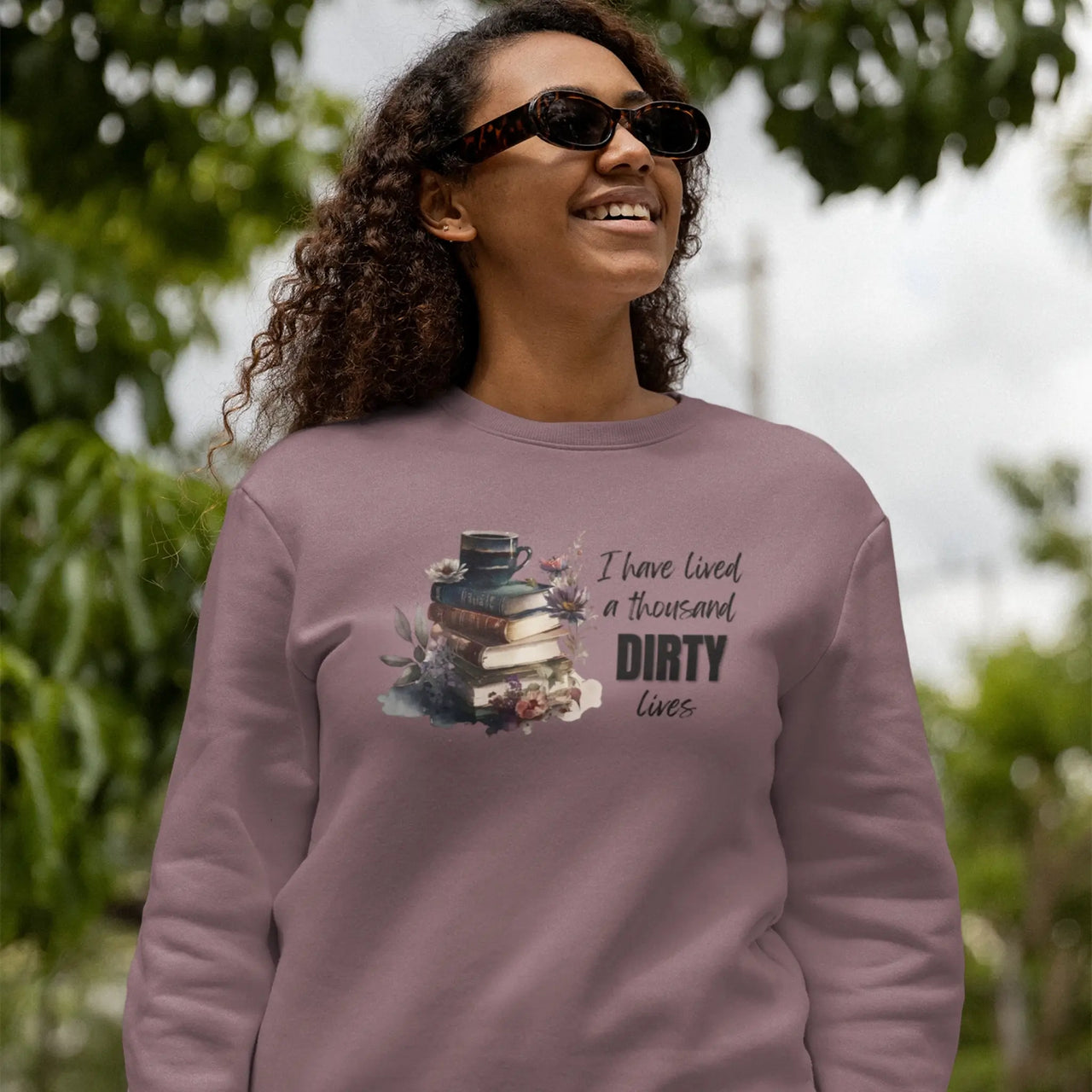 woman wearing a maroon I have lived a thousand dirty lives sweatshirt v2 design A