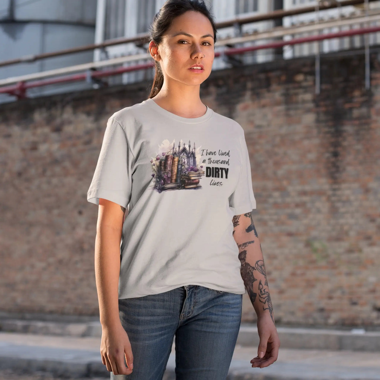 woman wearing a light grey I have lived a 1000 dirty lives tshirt V2 design B