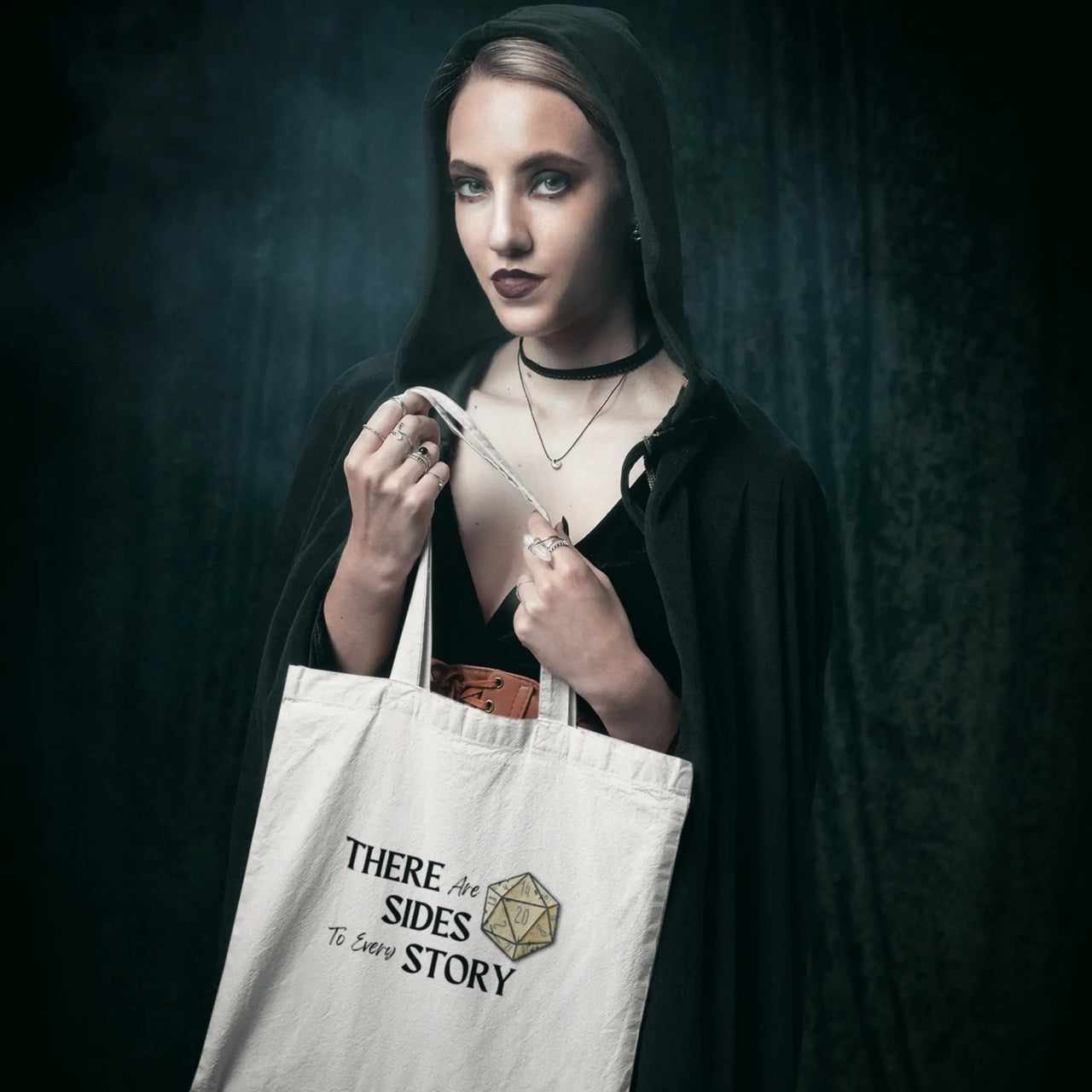 a woman in cosplay with a There are 20 sides to every story tote bag in white