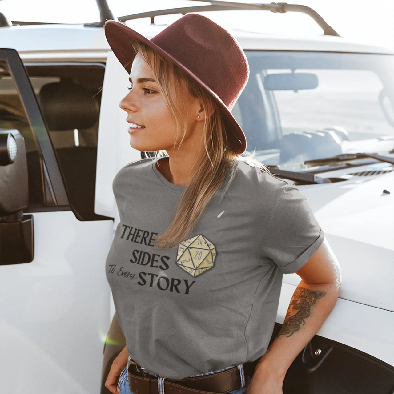 woman in a hat wearing a dark grey There are 20 sides to every story tshirt