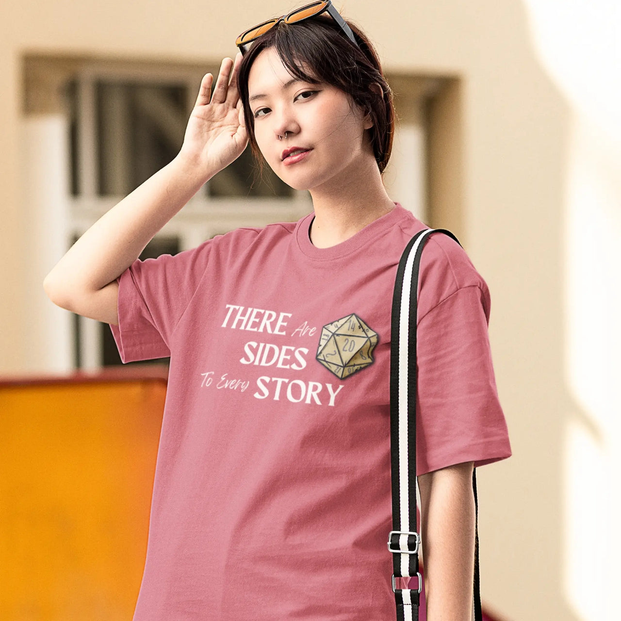 woman wearing a dark pink There are 20 sides to every story tshirt with white text