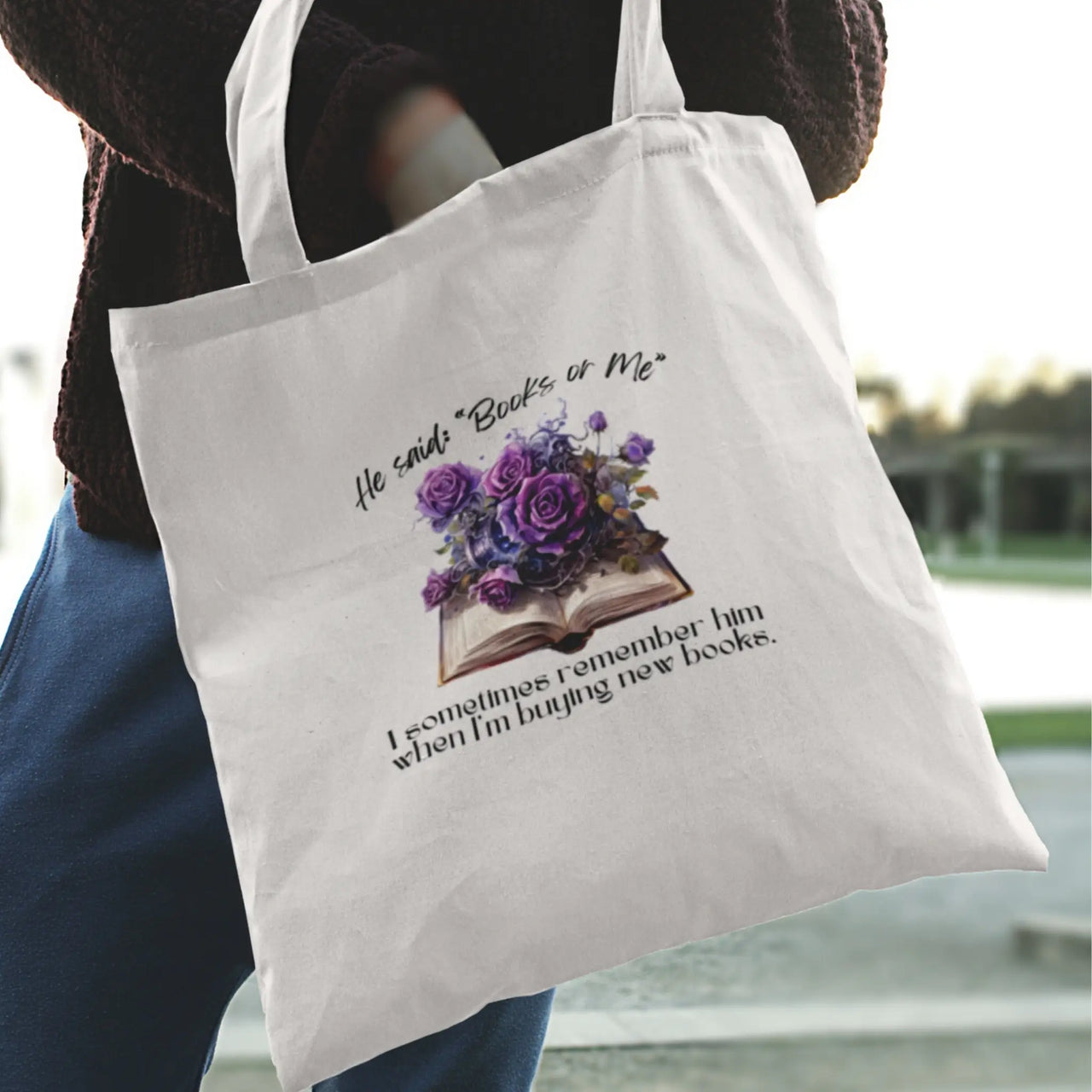 Reaching into a Books or Me tote bag in white