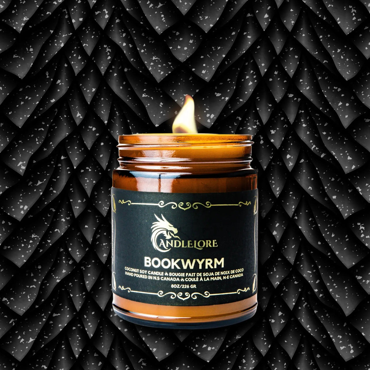 BookWyrm Candle With a background of scales