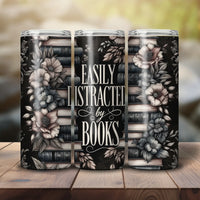 Thumbnail for Easily Distracted By Books Skinny Tumbler outdoors on a wood table