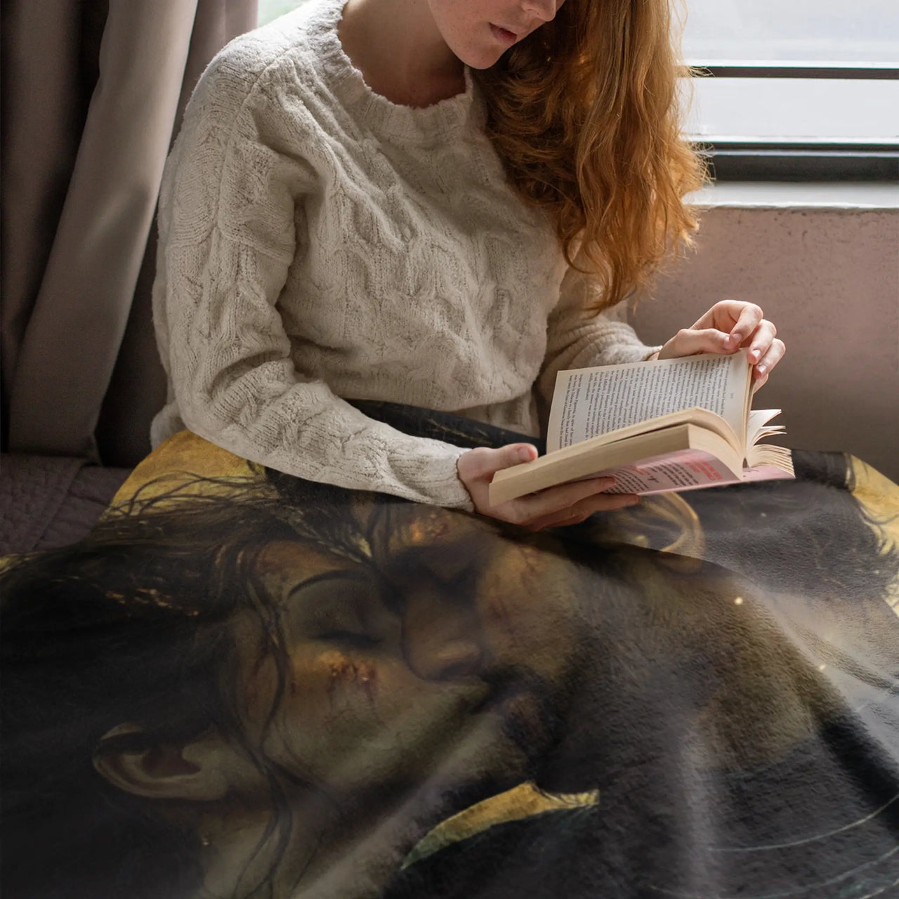 woman reading a book under the Friends To Lovers Blanket