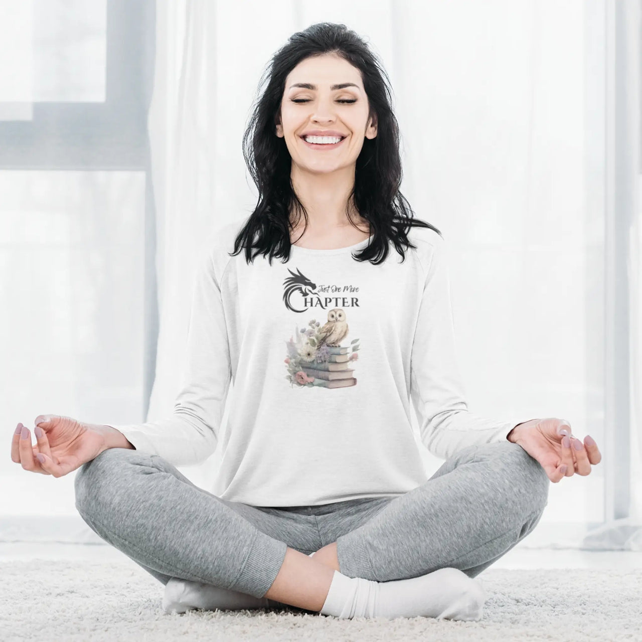 woman doing yoga in a Just One More Chapter long sleeve shirt V2 in white with a small owl