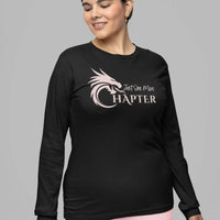 Thumbnail for woman wearing a Just One More Chapter Logo design long sleeve in black with pink text