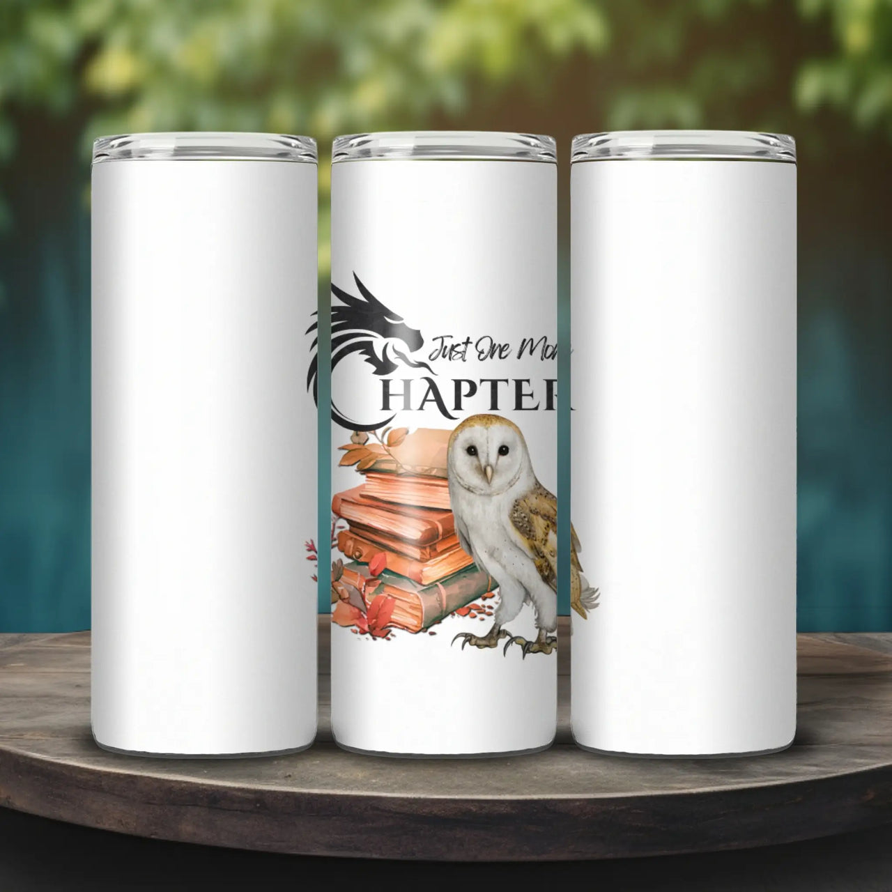 Just One More Chapter Skinny Tumbler on a wooden platform outdoors