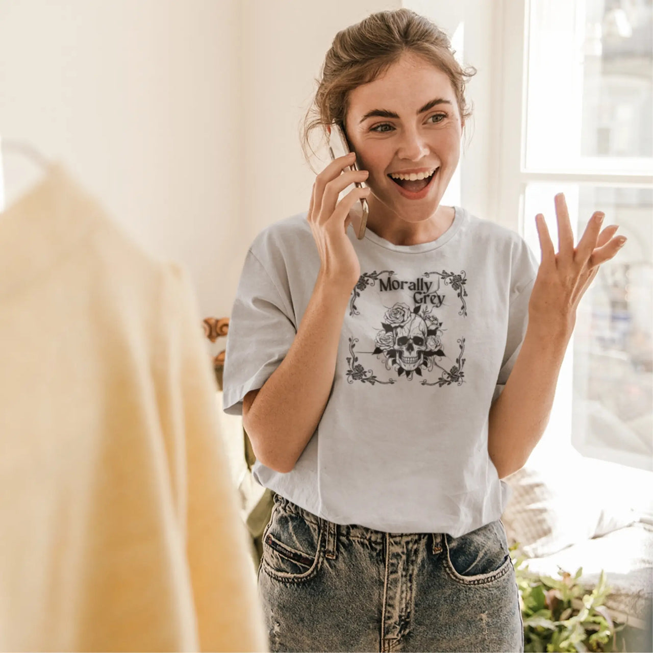 young woman wearing the light grey morally grey tshirt