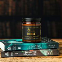 Thumbnail for Rowan candle resting on books