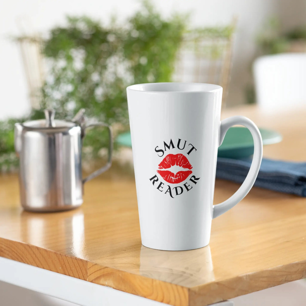 white large smut reader mug on a table