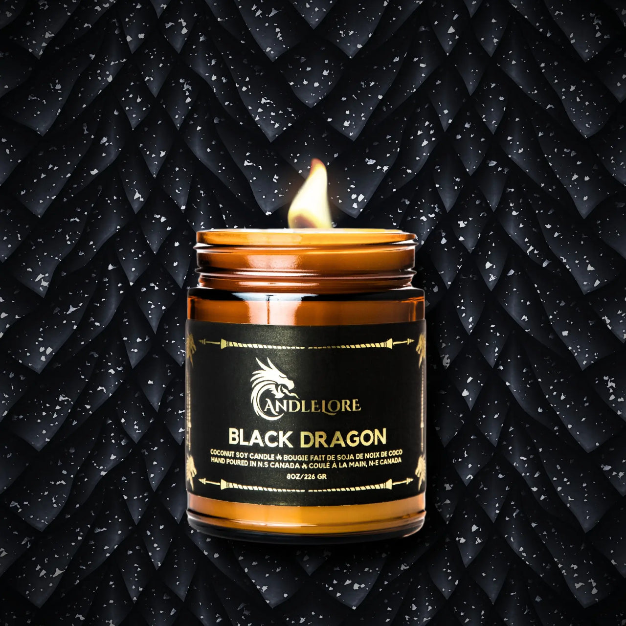 Lit Medium Black Dragon Candle on black scale background