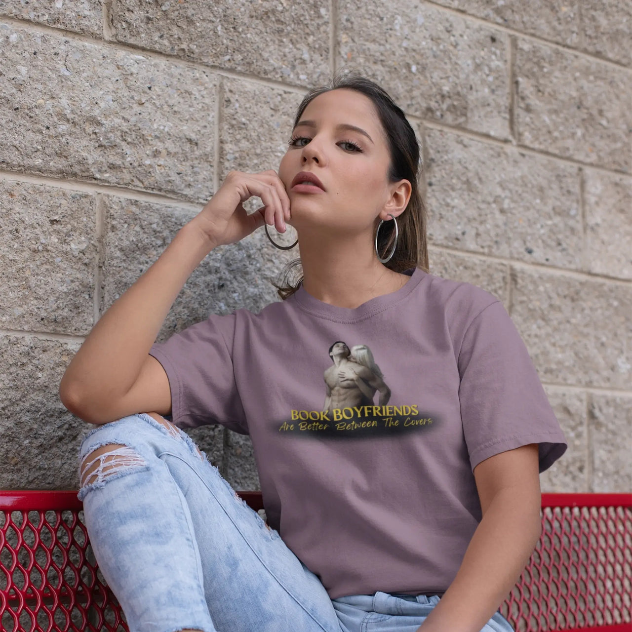 woman on a bench wearing a Maroon Book Boyfriends Are Better Between The Covers tshirt