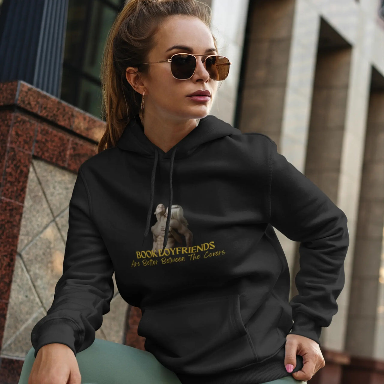 woman wearing a black Book Boyfriends Are Better Between The Covers Hoodie