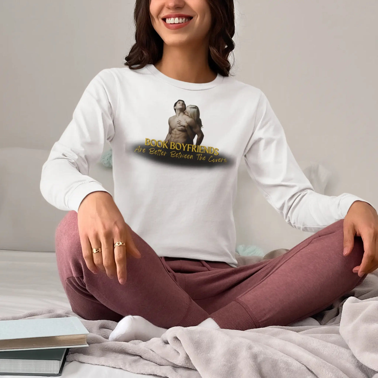 woman wearing a Book Boyfreinds Are Better Between The Covers long sleeve t-shirt in white