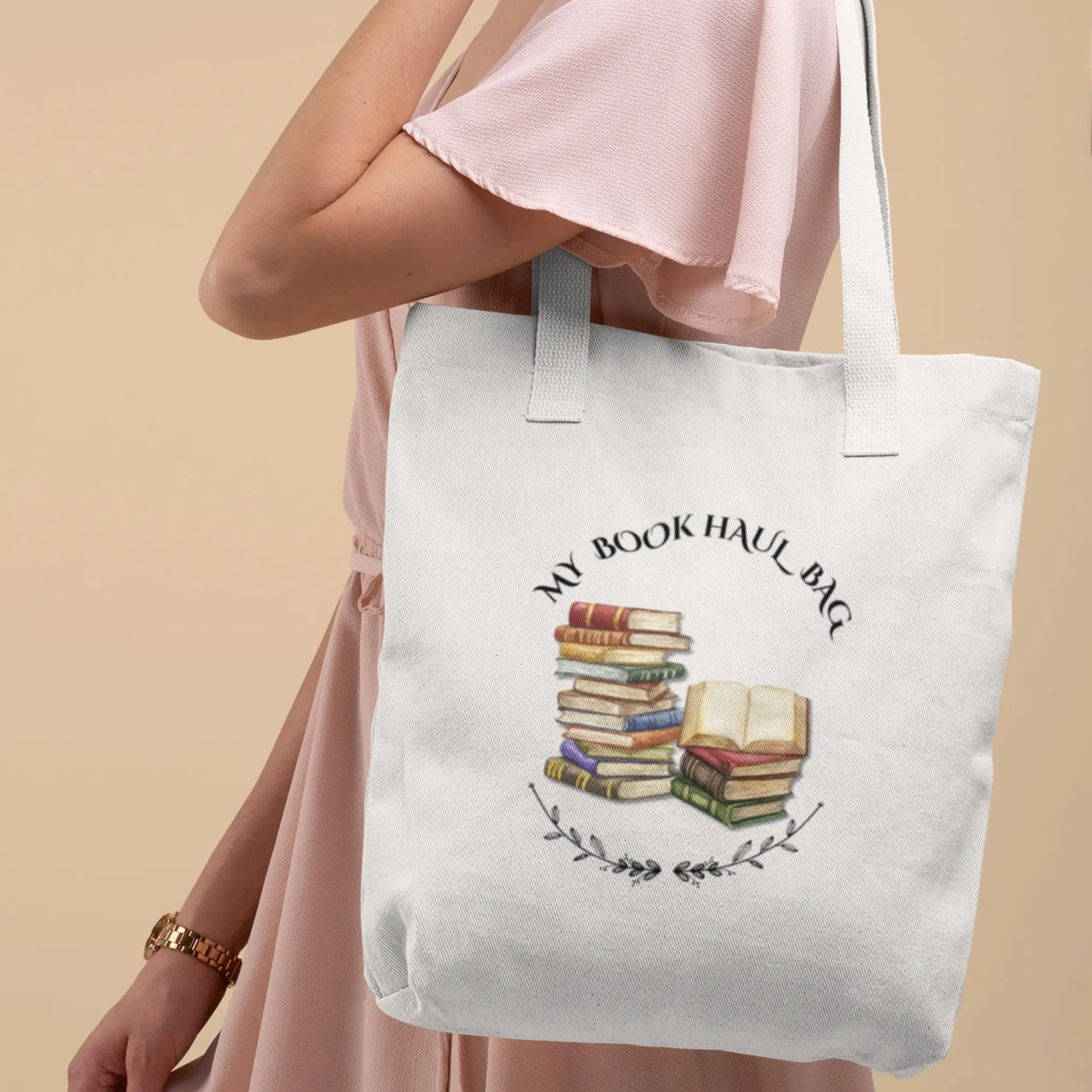 woman carrying a white version of theMy Book Haul bag