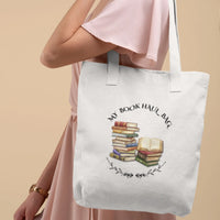 Thumbnail for woman carrying a white version of theMy Book Haul bag