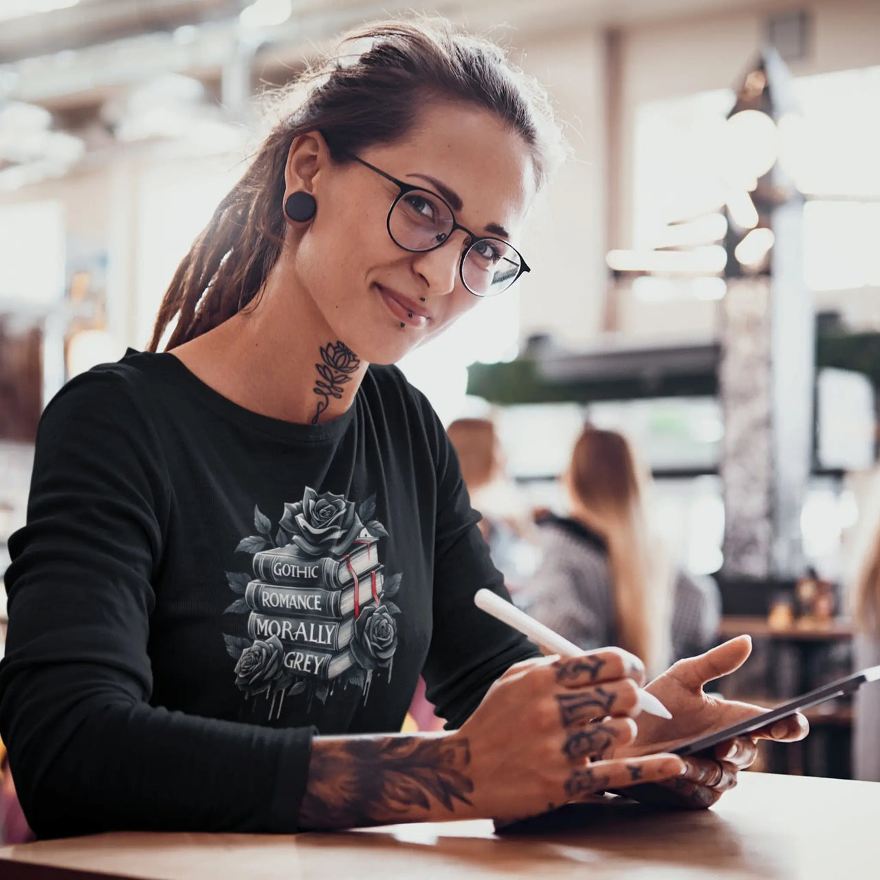 woman weraing a Bookish long sleeve tee in black