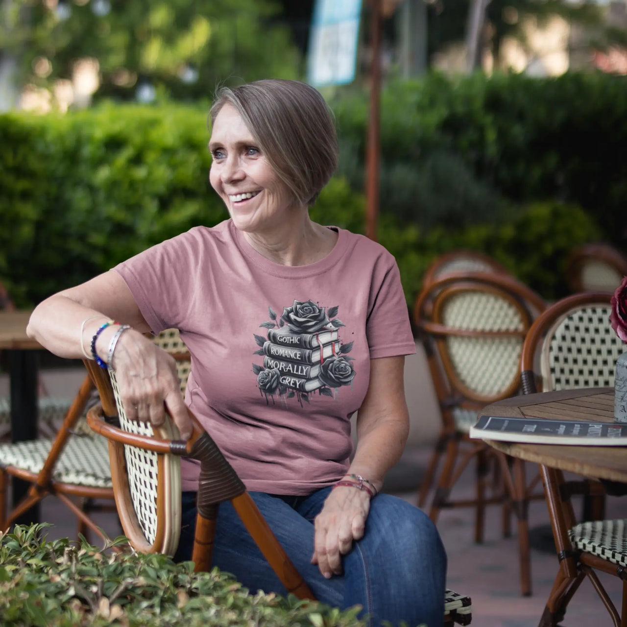 woman wearing the dark pink books and roses t-shirt