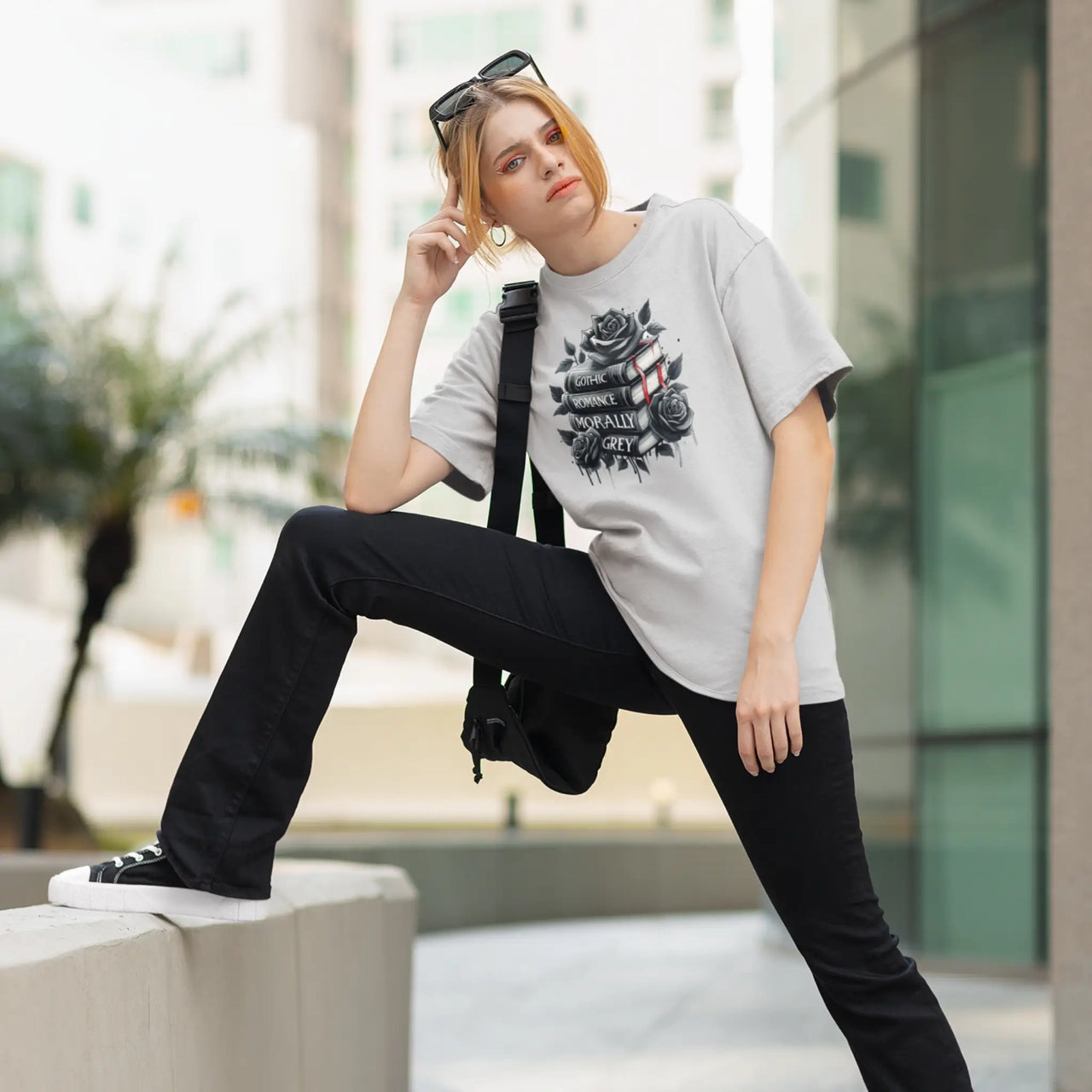 woman wearing a light grey books and roses t-shirt