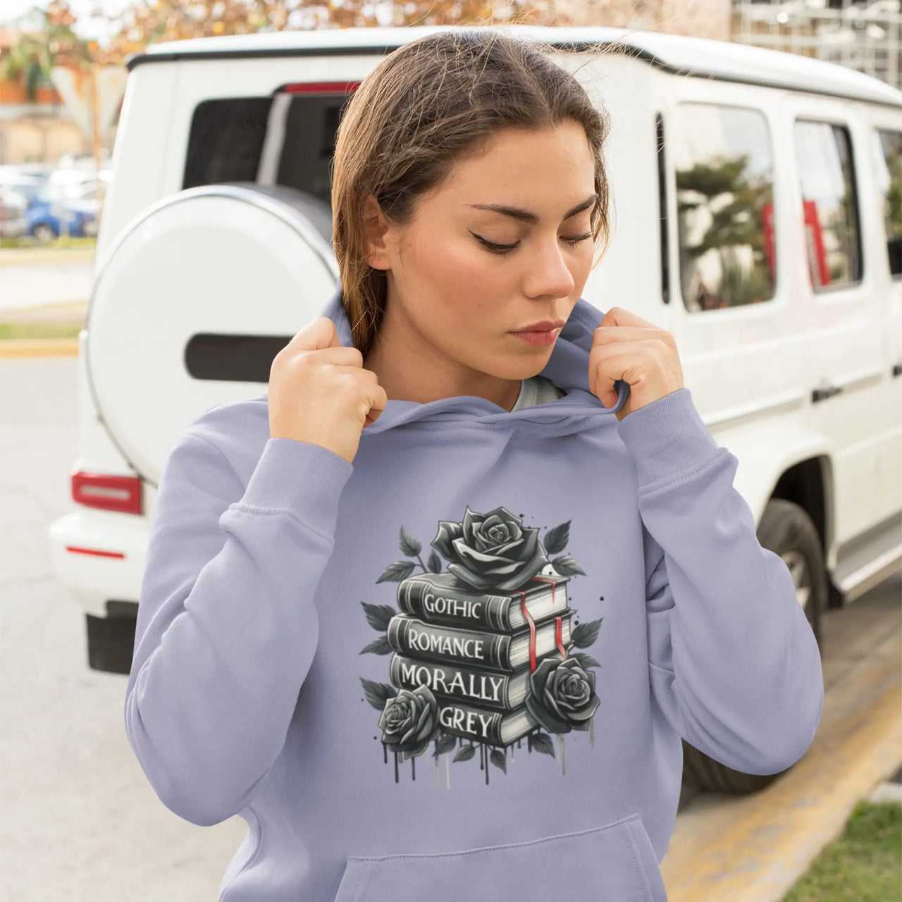 a woman posing in a Violet Books and Roses hoodie