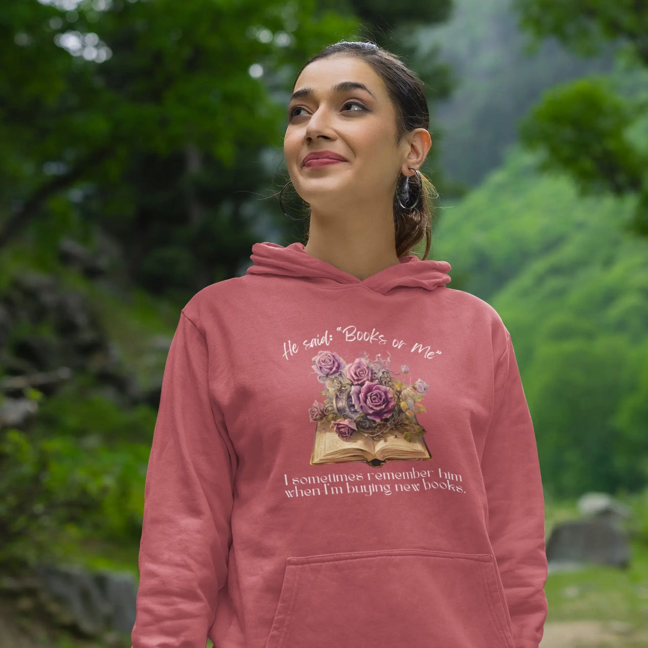 happy woman wearing a Dark Pink Books Or Me Hoodie with white text