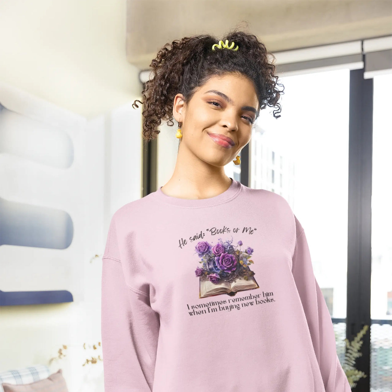 woman modeling a Pink Books or Me sweatshirt