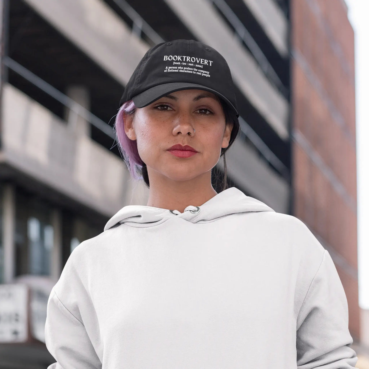 woman wearing a black Booktrovert cap