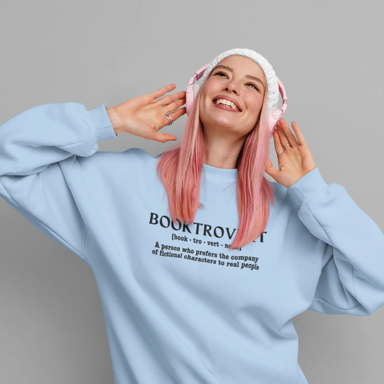 woman posing in a blue Booktrovert Sweatshirt