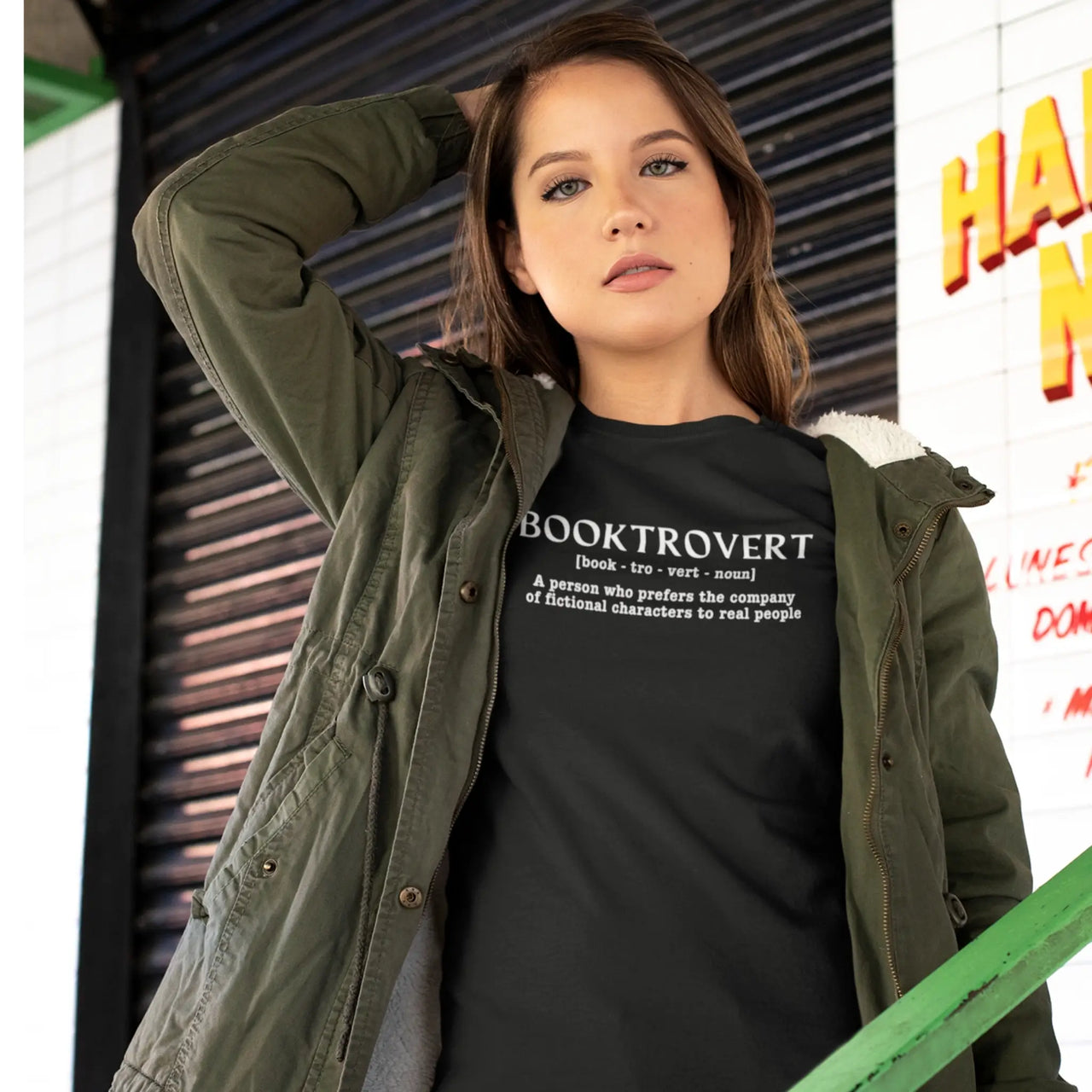 woman wearing a black booktrovert tshirt