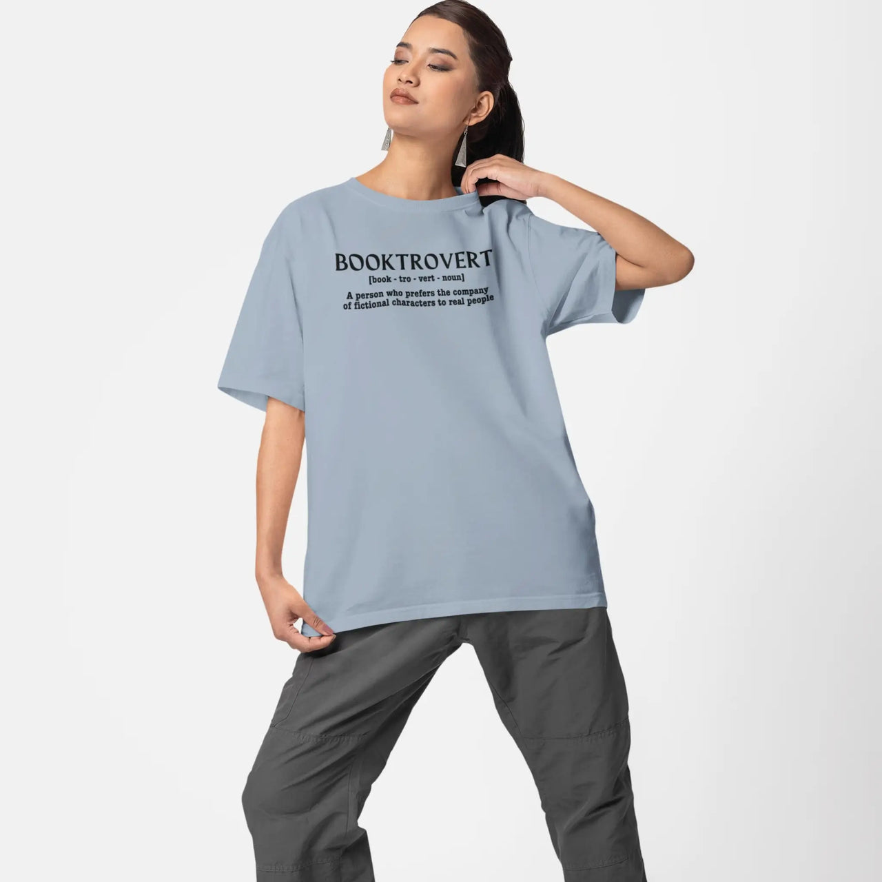 woman wearing a light blue booktrovert tshirt 