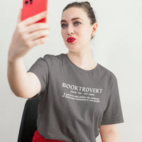 Thumbnail for woman wearing a dark grey booktrovert tshirt with white text