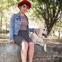 Thumbnail for woman wearing a heather maroon booktrovert tshirt with pink writing 