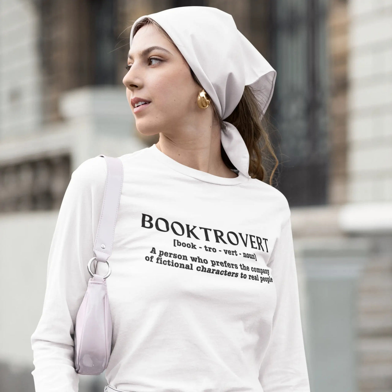 woman wearing a Booktrovert long sleeve tshirt in white