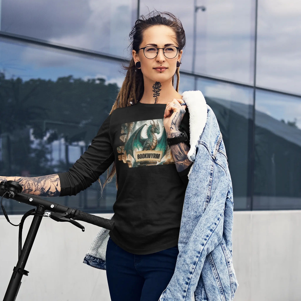 a woman wearing a black bookwyrm long sleeve t