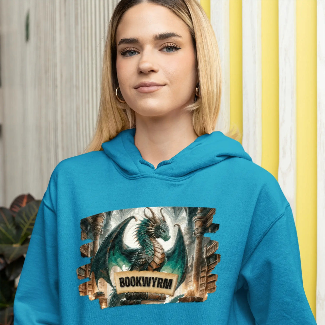 Smiling young woman wearing the Teal Bookwyrm Hoodie