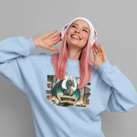 Thumbnail for content woman smiling while wearing a blue Bookwyrm sweatshirt