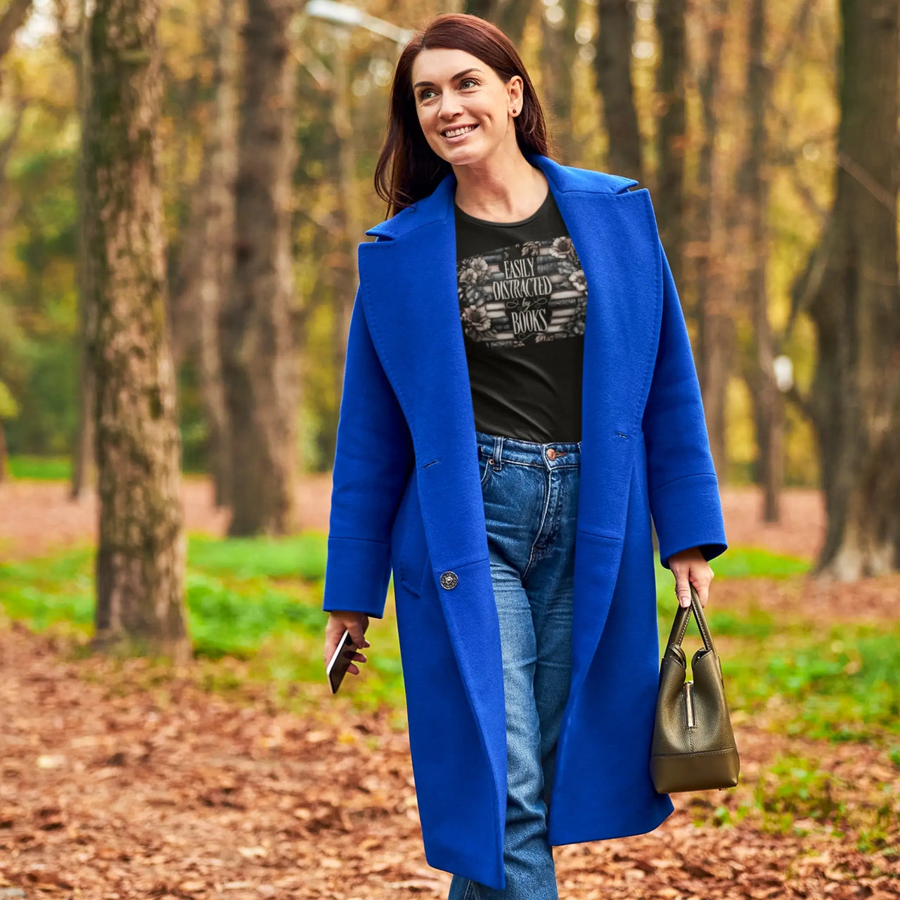 Black Easily distracted by books tshirt under a blue coat