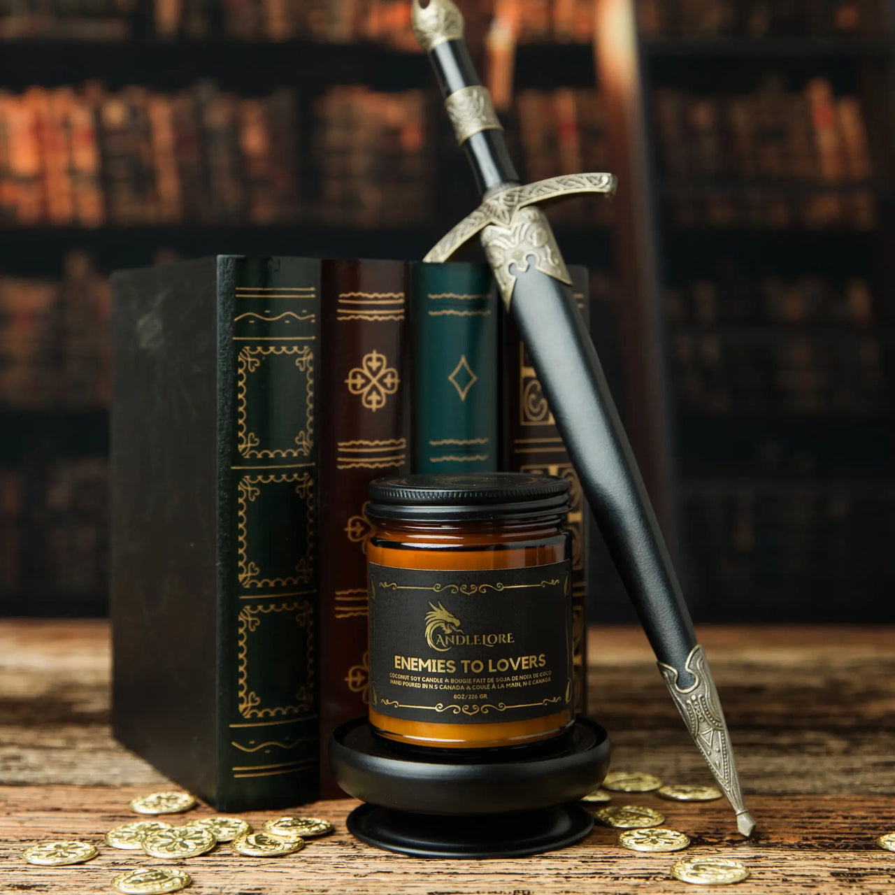 Medium Enemies To Lovers scented candle with books and a dagger