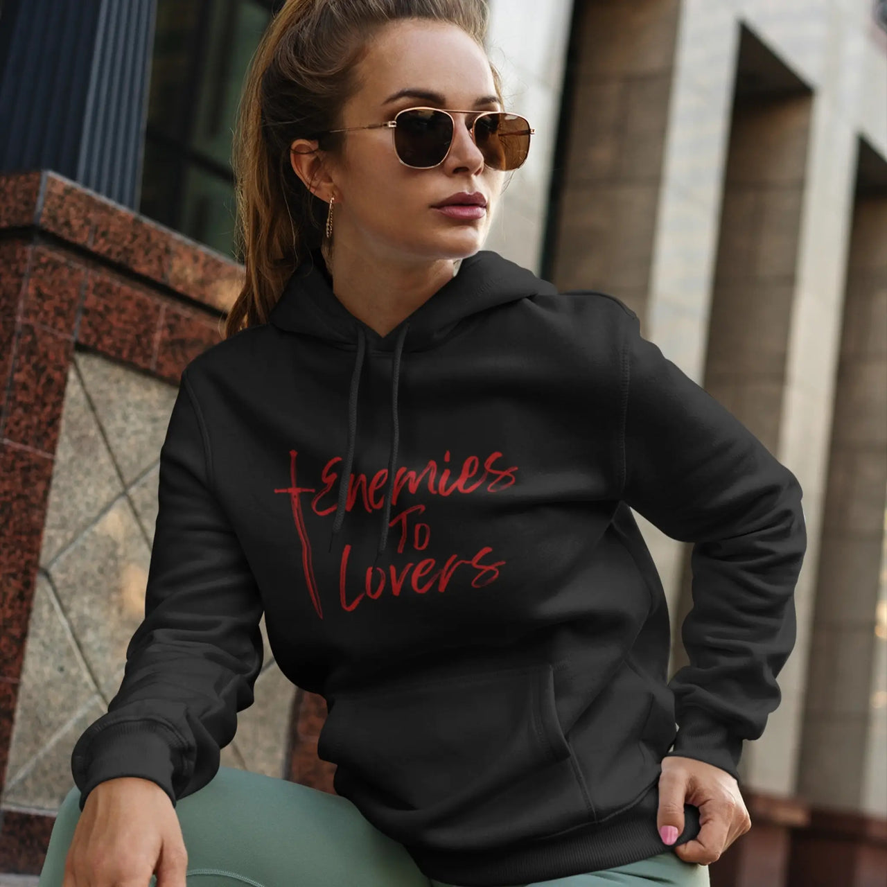 woman posing in a Black Enemies To Lovers Hoodie with red text