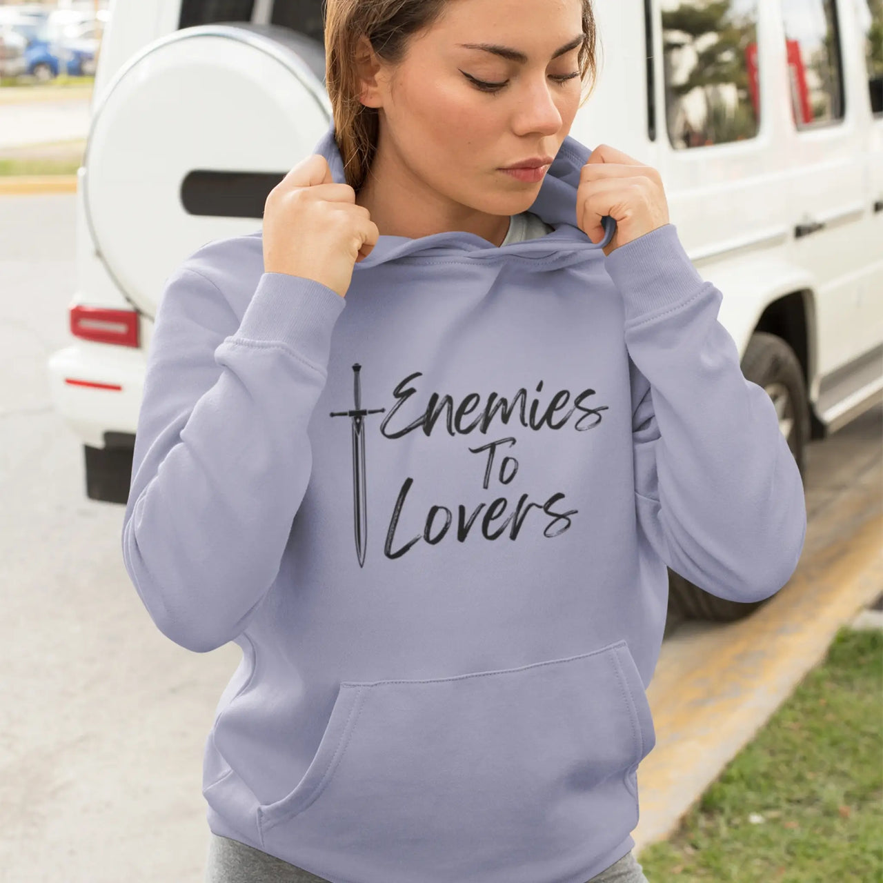 woman wearing a Violet Enemies To Lovers Hoodie with black text