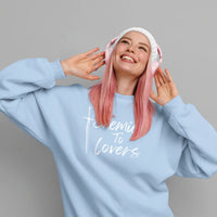 Thumbnail for young woman wearing a blue Enemies To Lovers sweatshirt with white text