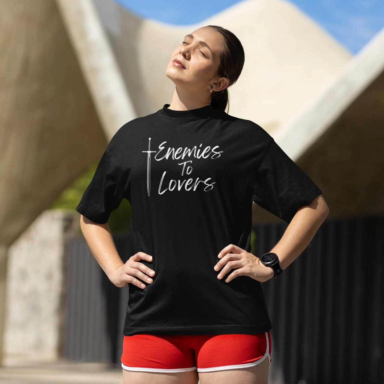 woman wearing a black Enemies To Lovers Tshirt