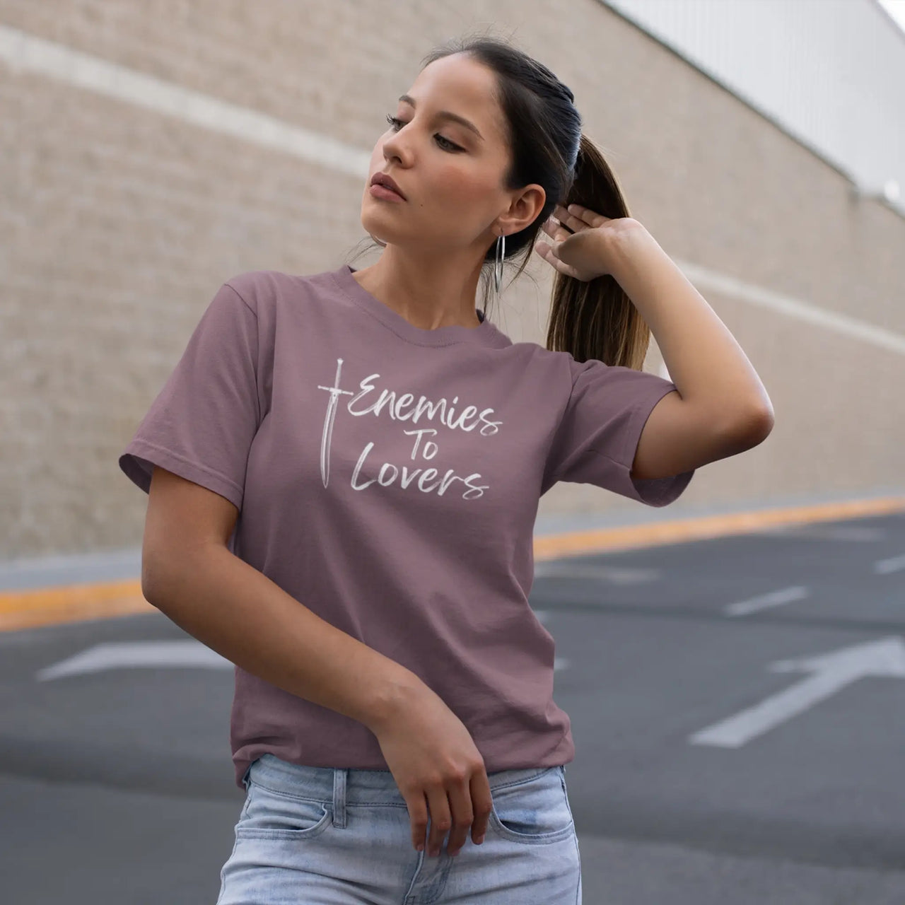 woman posing in a maroon Enemies To Lovers Tshirt