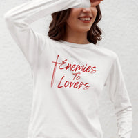 Thumbnail for young woman wearing a Enemies To Lovers Long Tshirt in white with red graphics