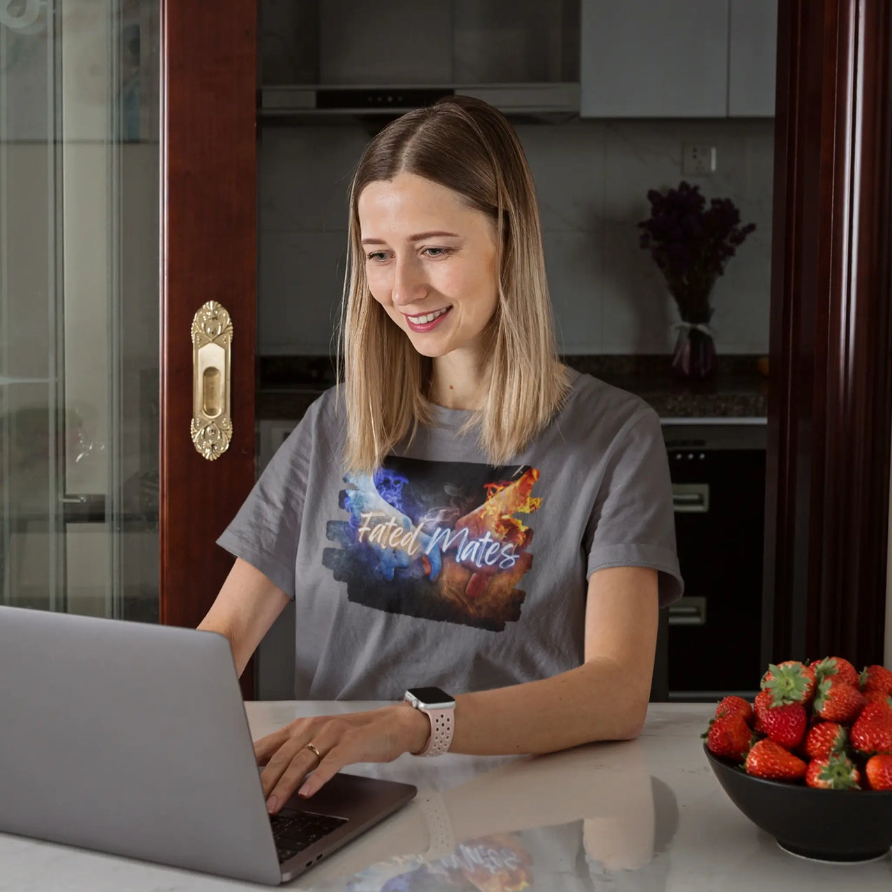 woman on her laptop wearing a dark grey Fated Mates Tshirt