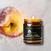 Thumbnail for frosted apples candles beside a snow covered apple