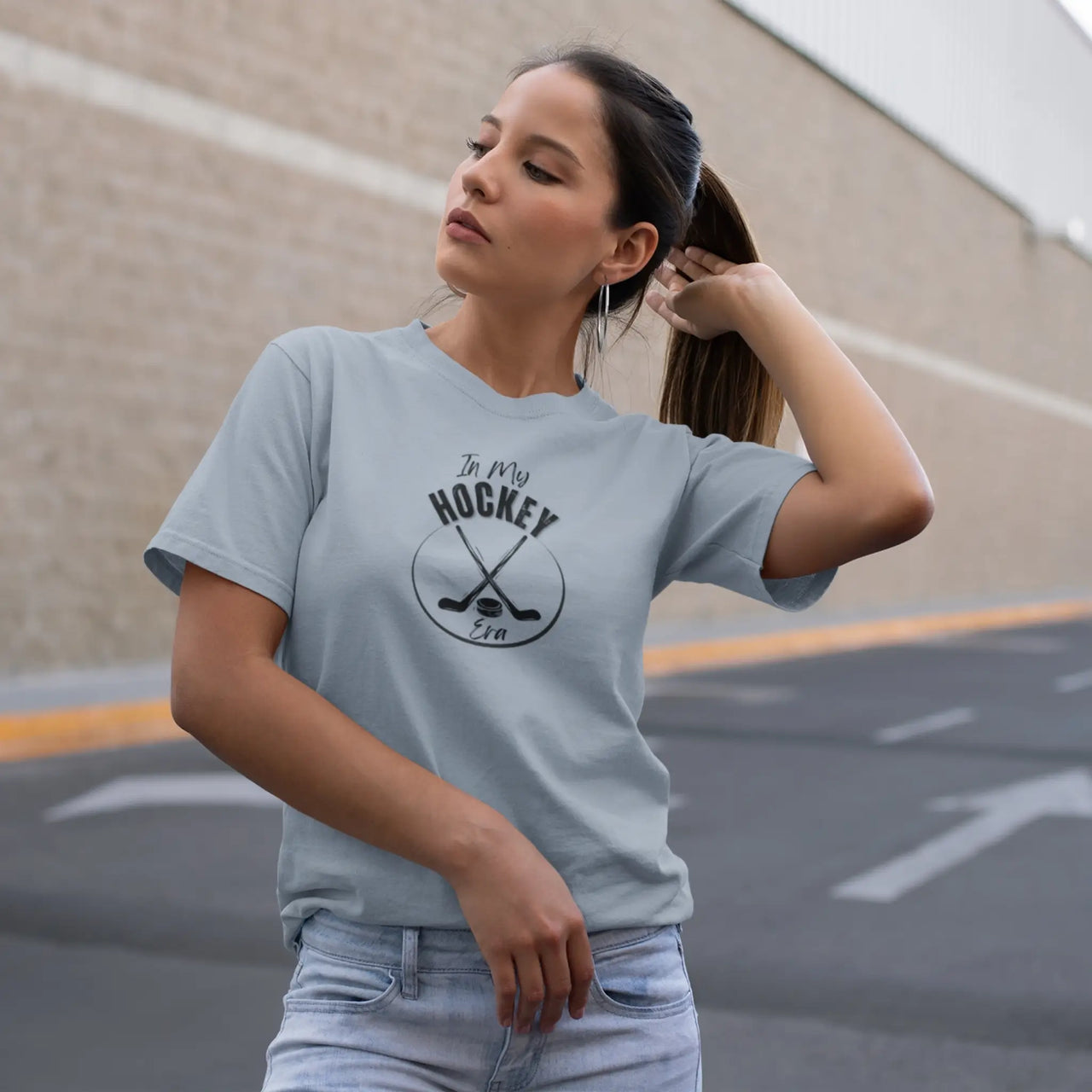 woman wearing a blue in my hockey era tshirt